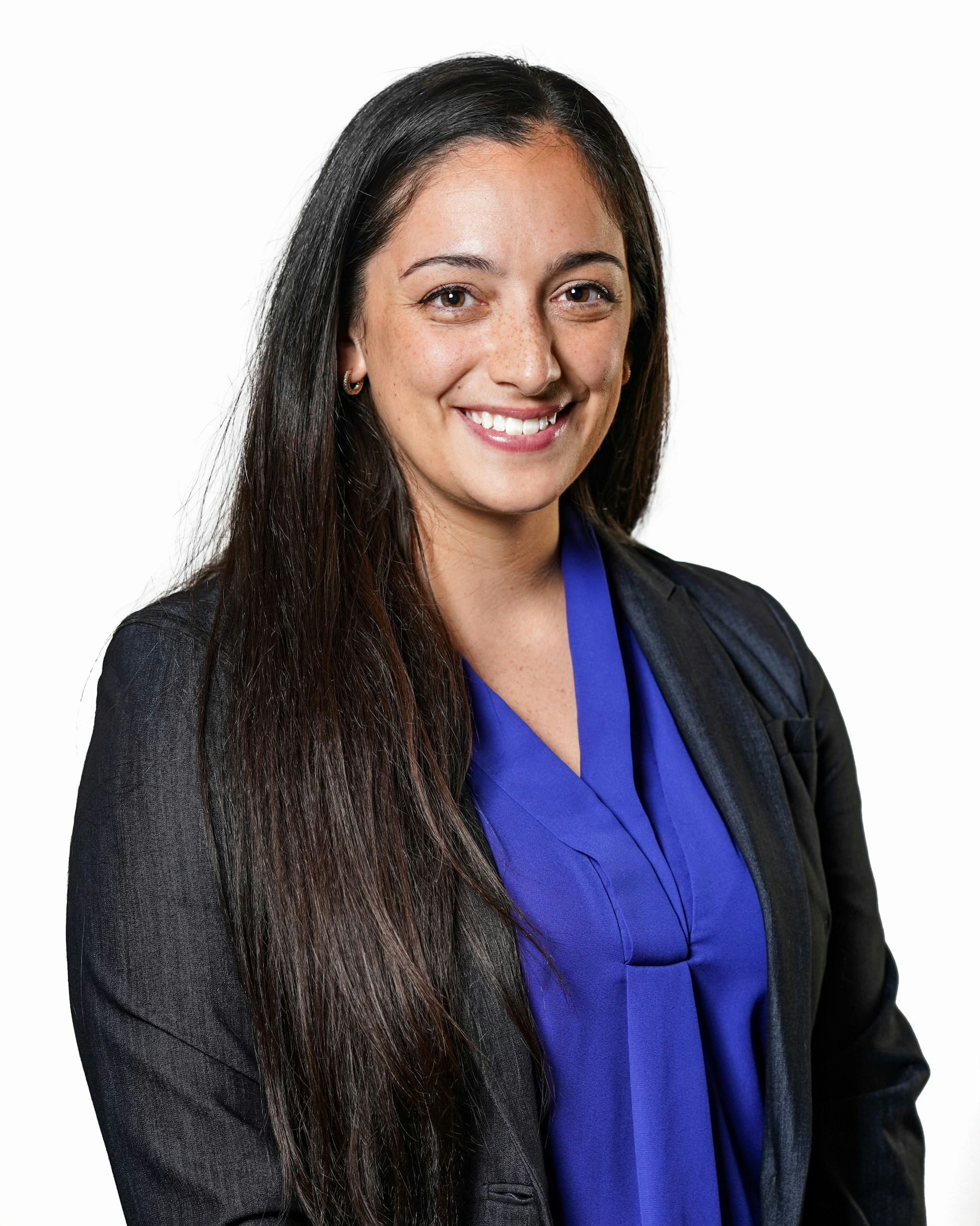 Business woman in black suit with purple blouse