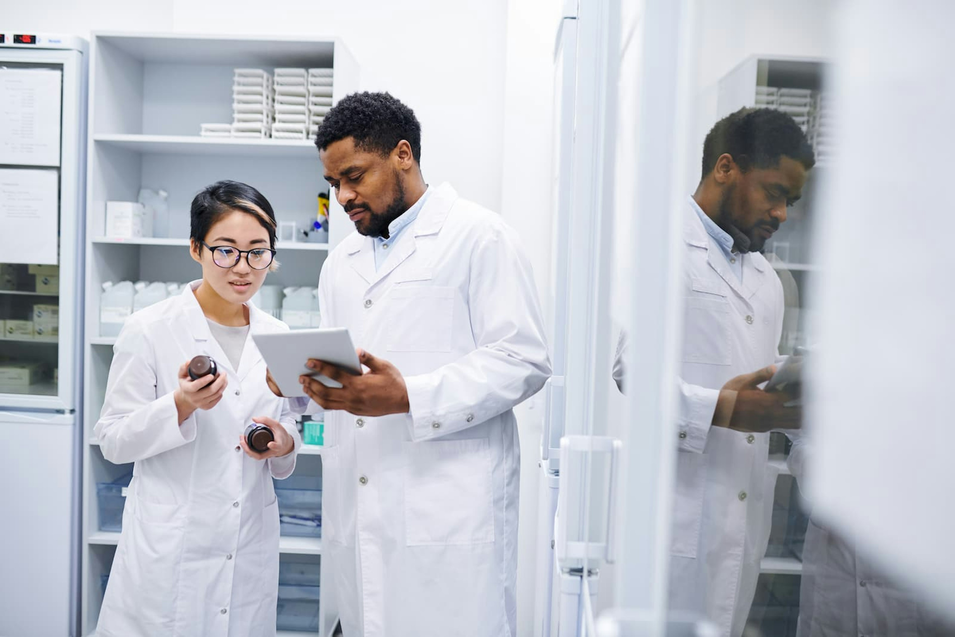 Lab technicians looking at information