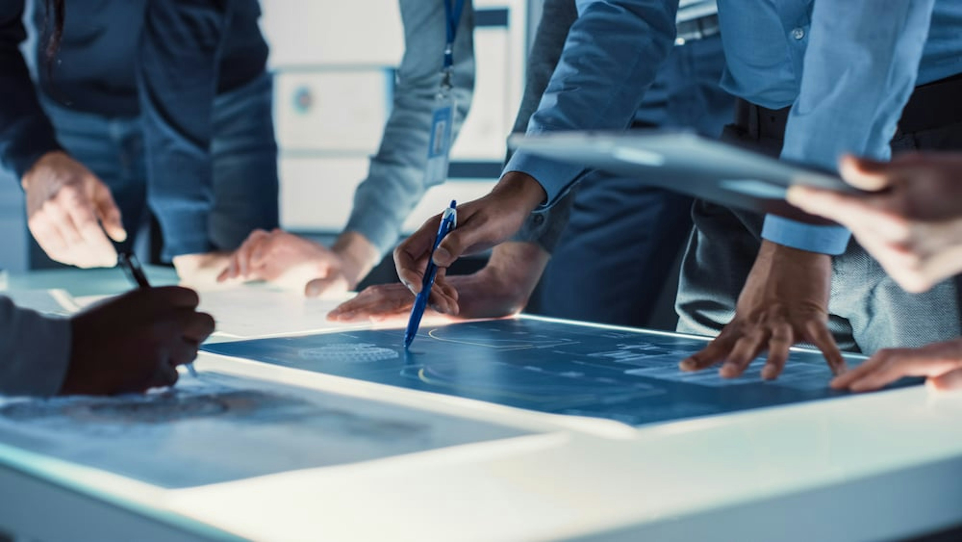 Closeup photo of team hands working on a project together