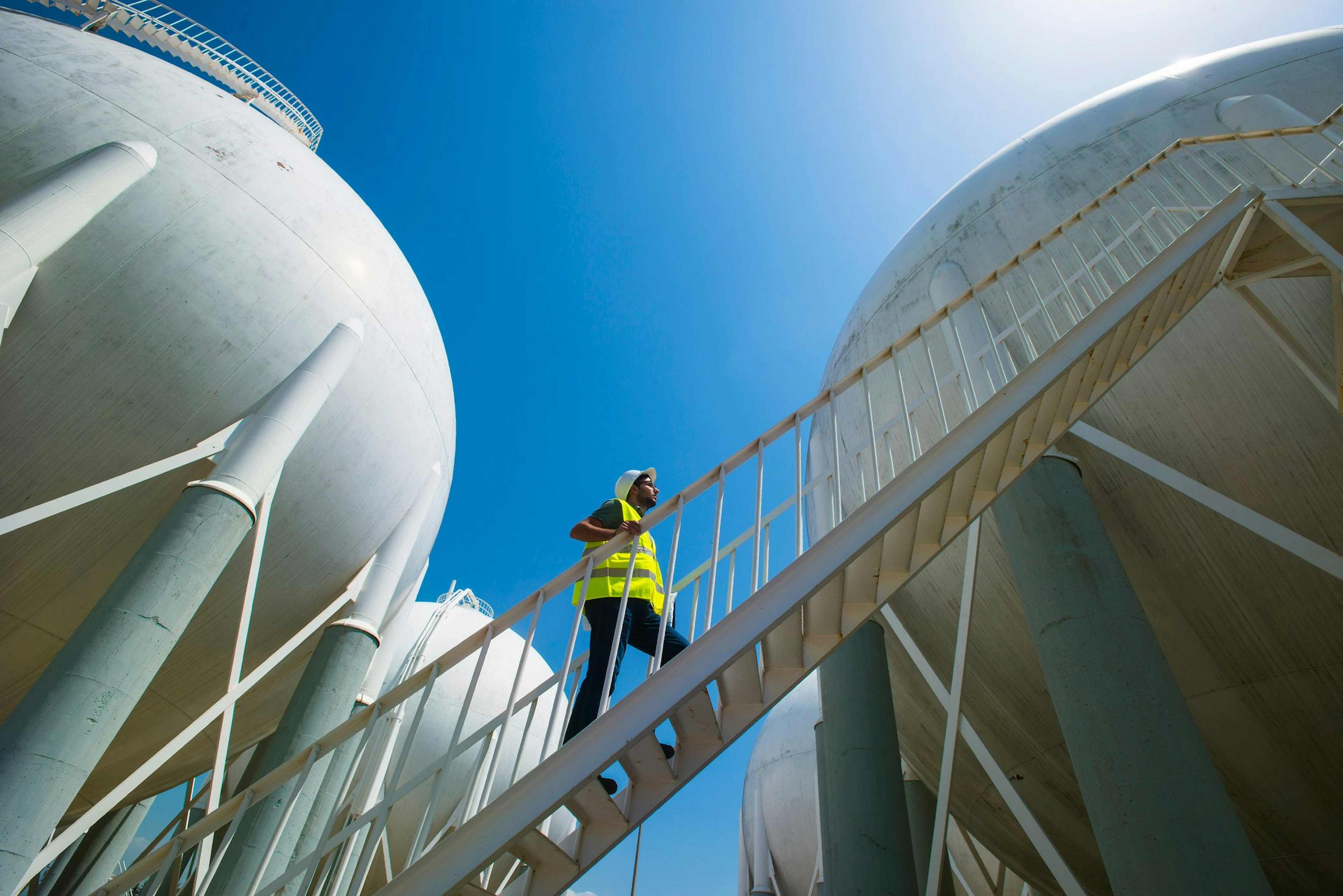 Commissioning Manager walks around an LNG facility. He and others fall on the list for best paying jobs in energy in 2024